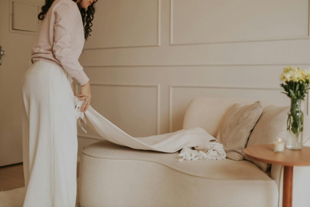 Clean and cosy living room styled with neutral decor and soft textures