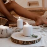 Cozy nighttime routine with candle, tea and soft lighting in bedroom