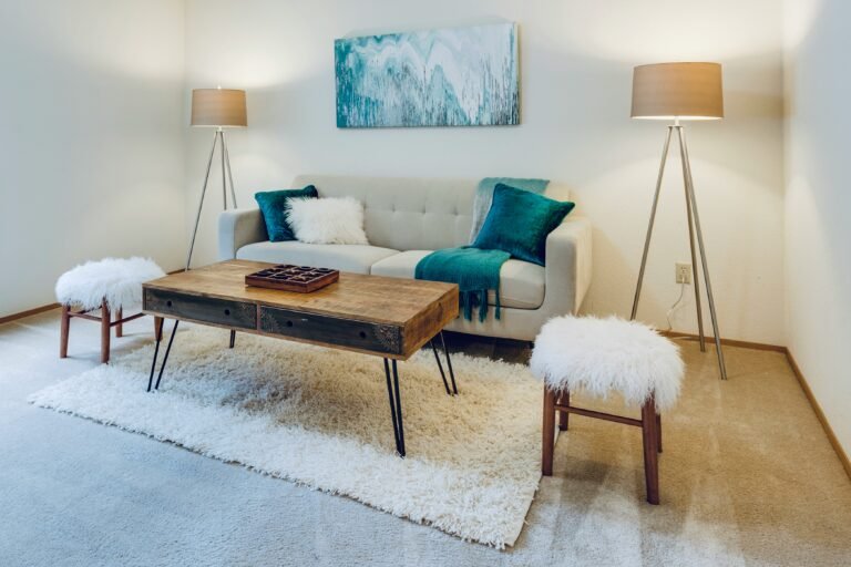 Soft and cosy living room decor with warm lighting and layered textures