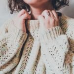 Woman in a chunky knit jumper styled for a cosy winter morning