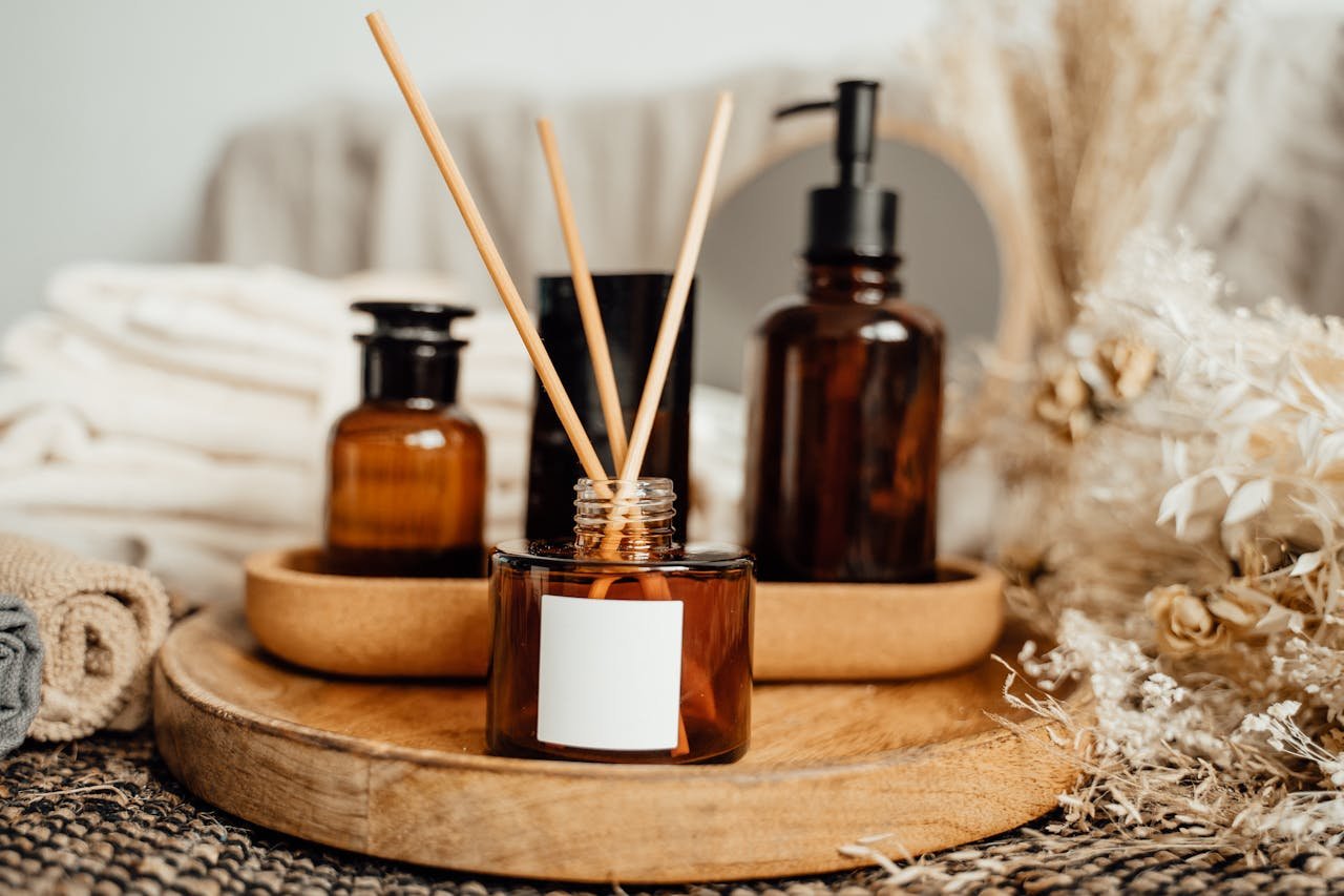 Aromatherapy arrangement with amber bottles and dried flowers for a fresh and calming home