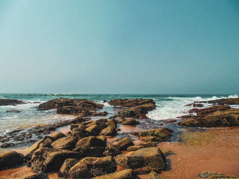 Ballito beachfront with golden sand, ocean waves and coastal scenery in KwaZulu-Natal featured in a Ballito travel guide about beach walks, luxury stays and coastal cafés