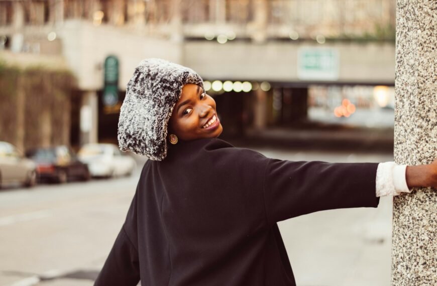 Girl in winter wear glowing skin cosy winter beauty routine South African winter beauty habits