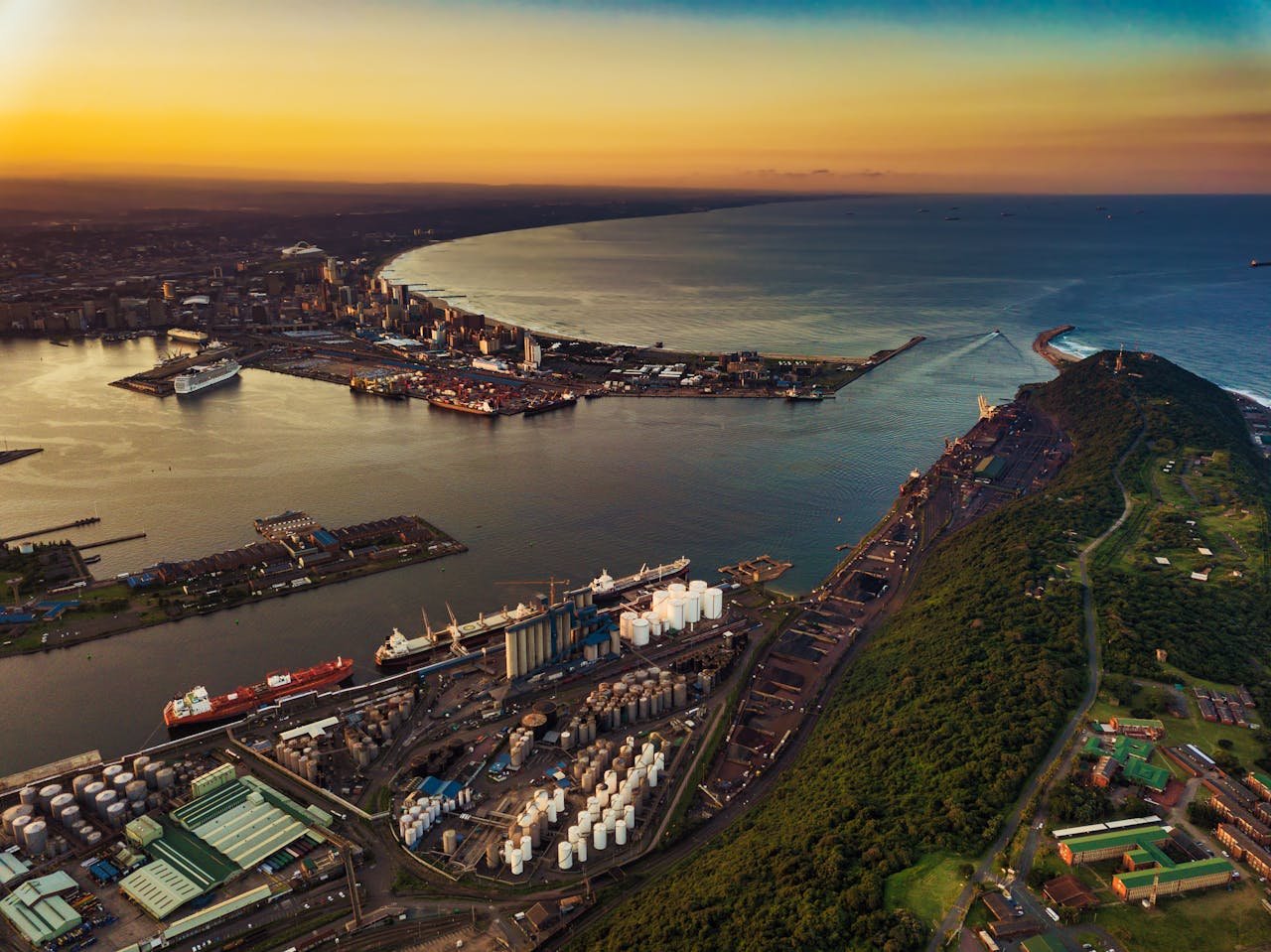Rooftop ocean view in Durban at sunset with cocktails and coastal skyline