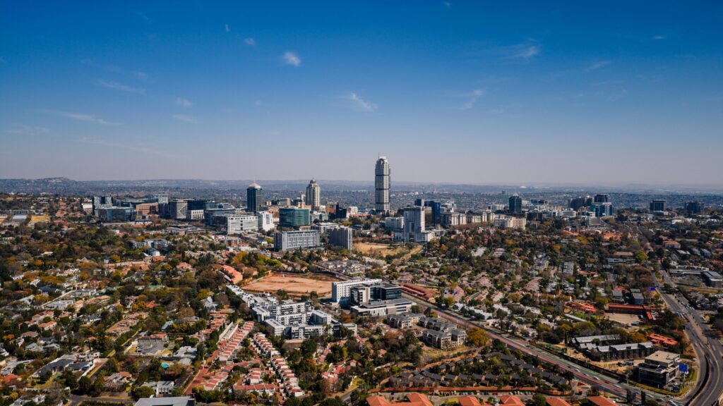  urban skyline of Sandton in Gauteng, with its mix of modern skyscrapers and suburban areas